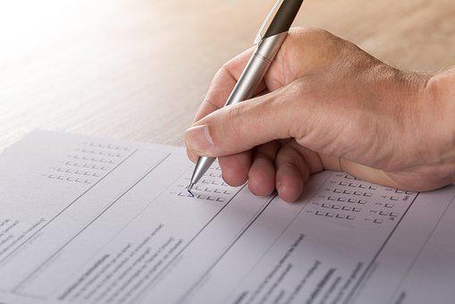 Picture of a person filling out forms