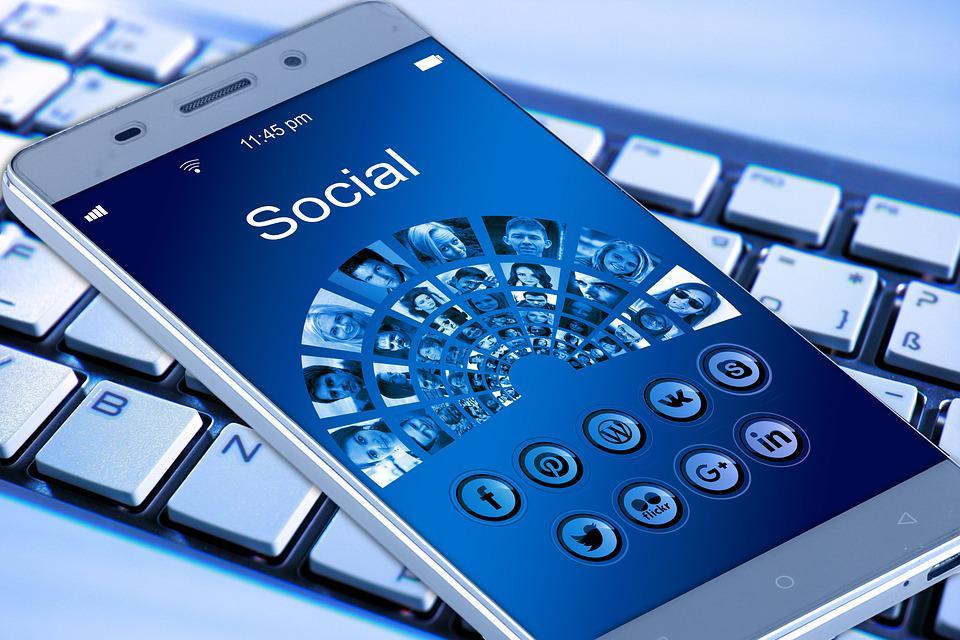 Picture of a phone showing social media icons
