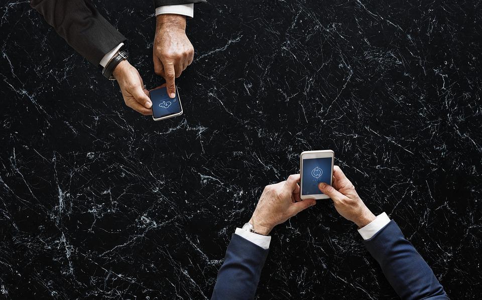 how to flip websites - picture of two people using mobile phones