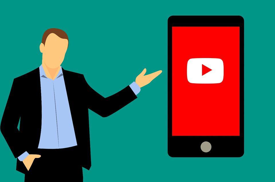 Video search - a guy pointing at a mobile phone